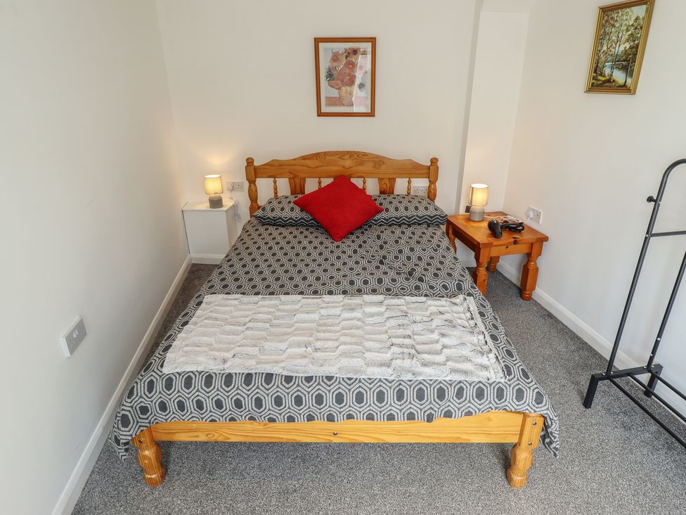 A bedroom with a bed and bedside table at Number 3 Old Boston Road in Coningsby