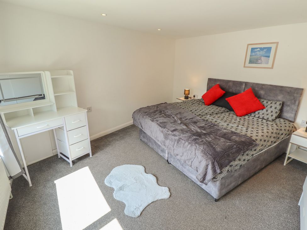 A bedroom with a bed and dresser at Number 3 Old Boston Road in Coningsby