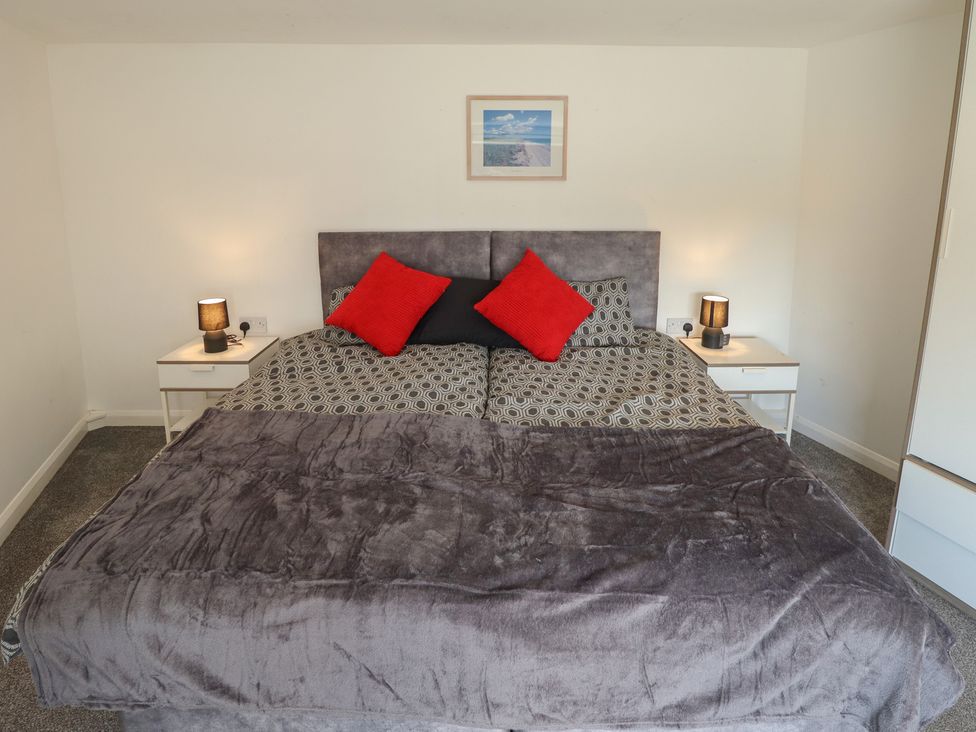 A bedroom with a bed and bedside tables at Number 3 Old Boston Road, Coningsby