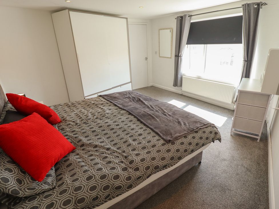 A bedroom with a bed and dresser at Number 3 Old Boston Road Coningsby