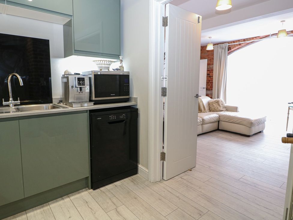 A kitchen with a sink and appliances at 1 Bed in Bishop's Waltham