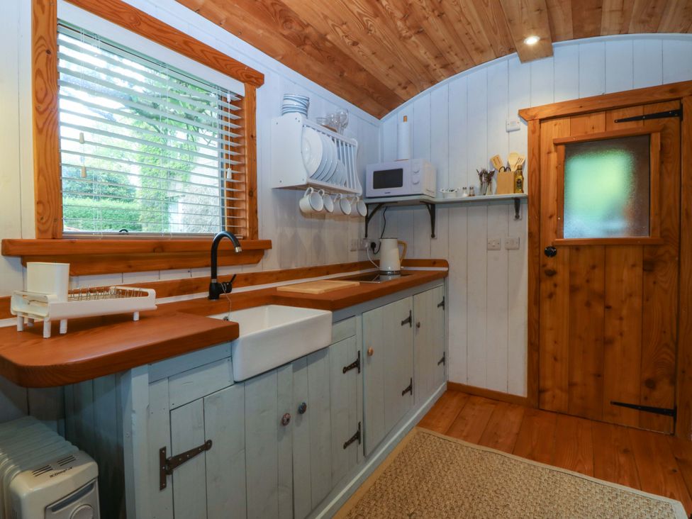 A kitchen with a sink and countertop at Ardwyn in Pwllheli