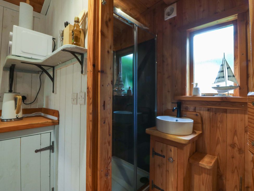 A bathroom with a shower and sink at Ardwyn in Pwllheli
