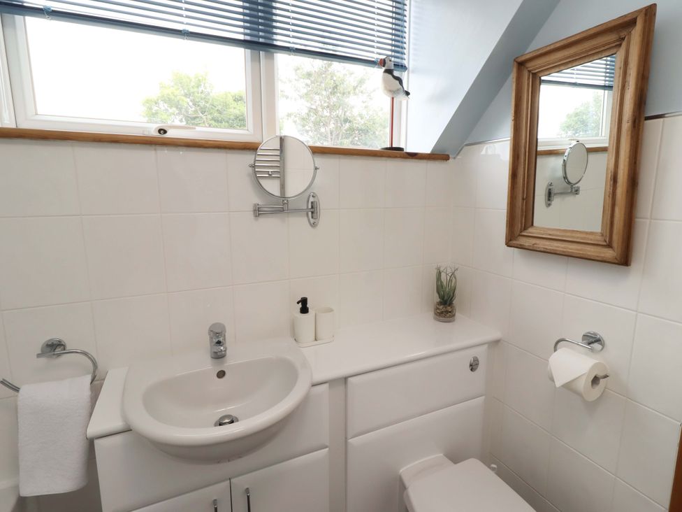 A bathroom with sink and toilet at Sarah's Cottage