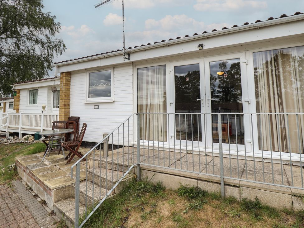 An outdoor area with a table and chairs at Cosy Home in Great Yarmouth