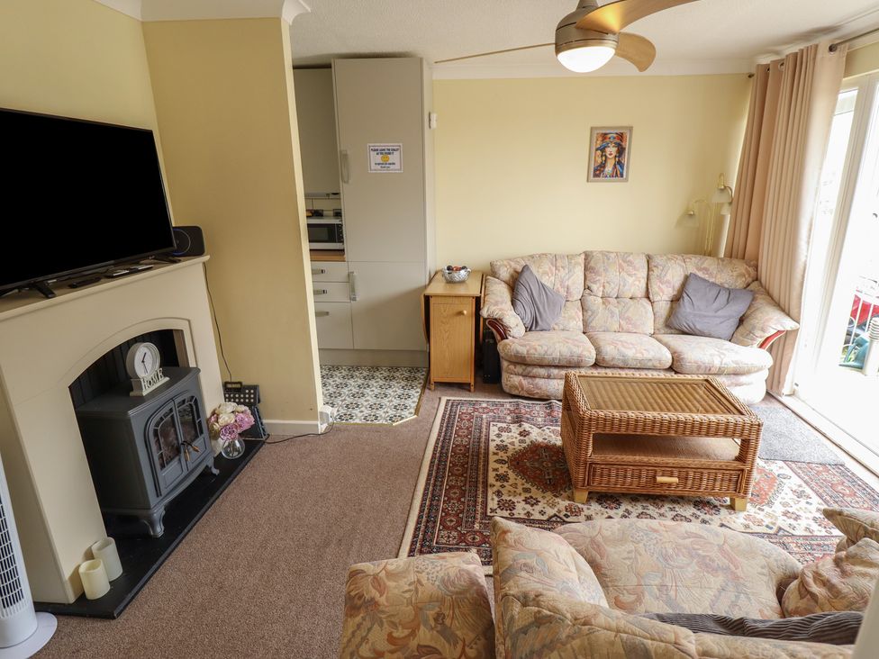 A living room with a sofa and television at Cosy Home in Great Yarmouth