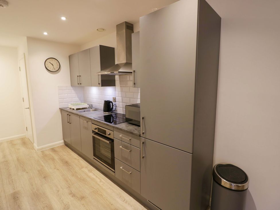 A kitchen with cabinets and appliances at Park-View Nook Birmingham