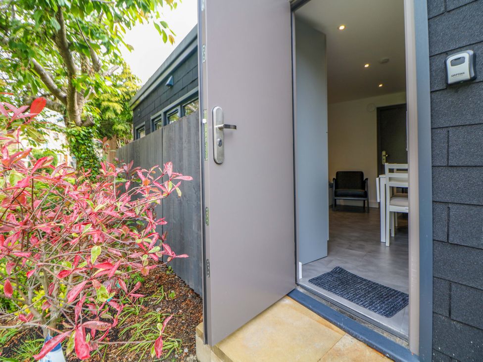 An entrance view with a door open and furniture visible at Dore Cabin Sheffield