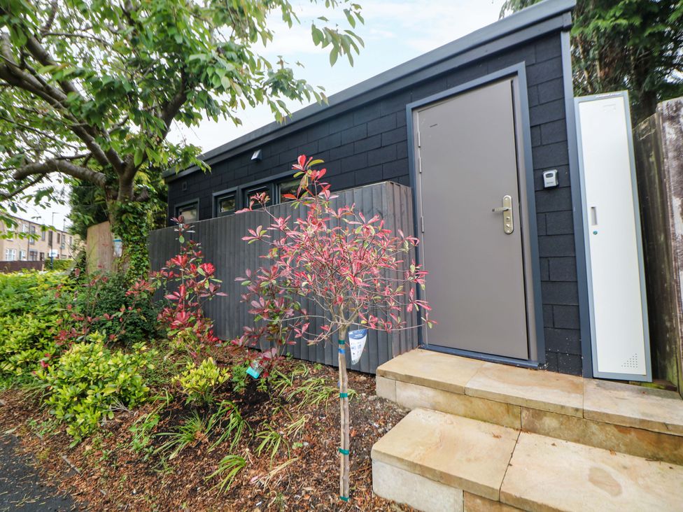 A building with a door and steps at Dore Cabin Sheffield
