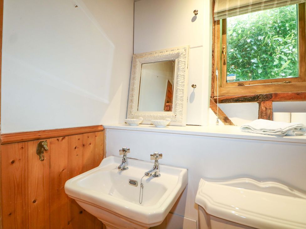 A bathroom with a sink and toilet at Petworth Barn in Petworth