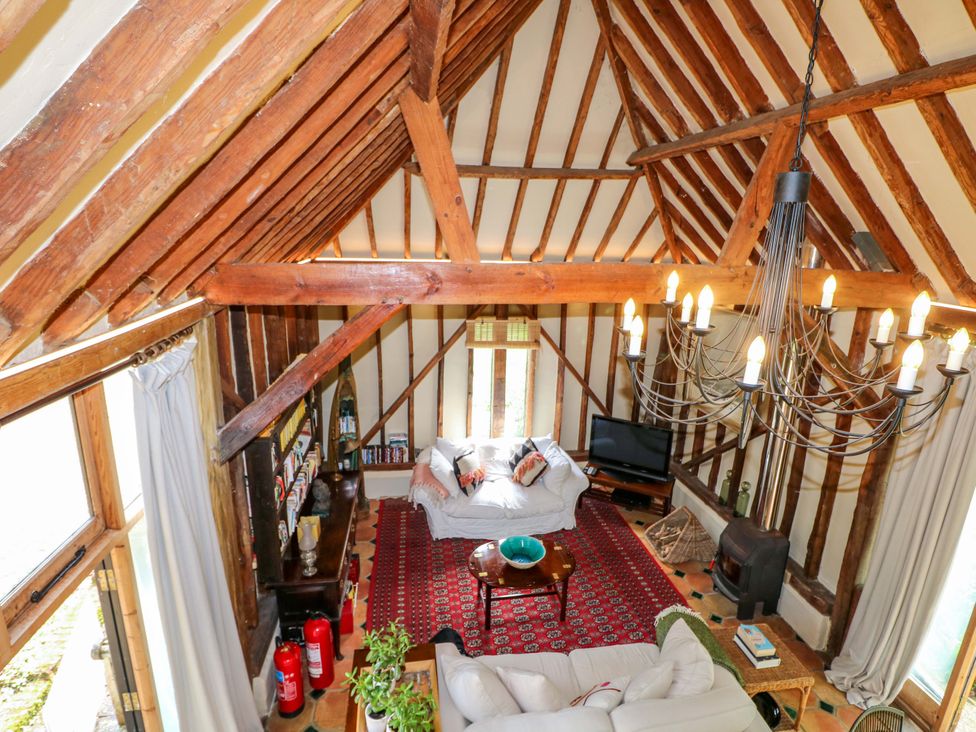 A living room with a sofa and coffee table at Petworth Barn in Petworth