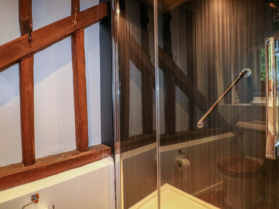 A bathroom with a shower and toilet at Petworth Barn in Petworth