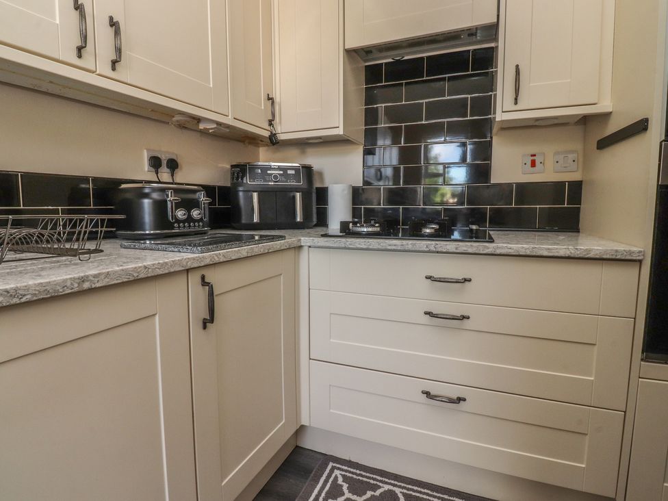 A kitchen with appliances and storage at 10 Oak Street in Keighley
