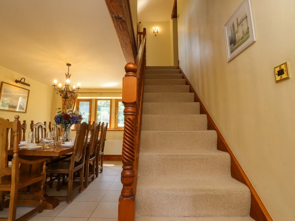 A dining room with a table and chairs at Sheephouse Farm in Bacup