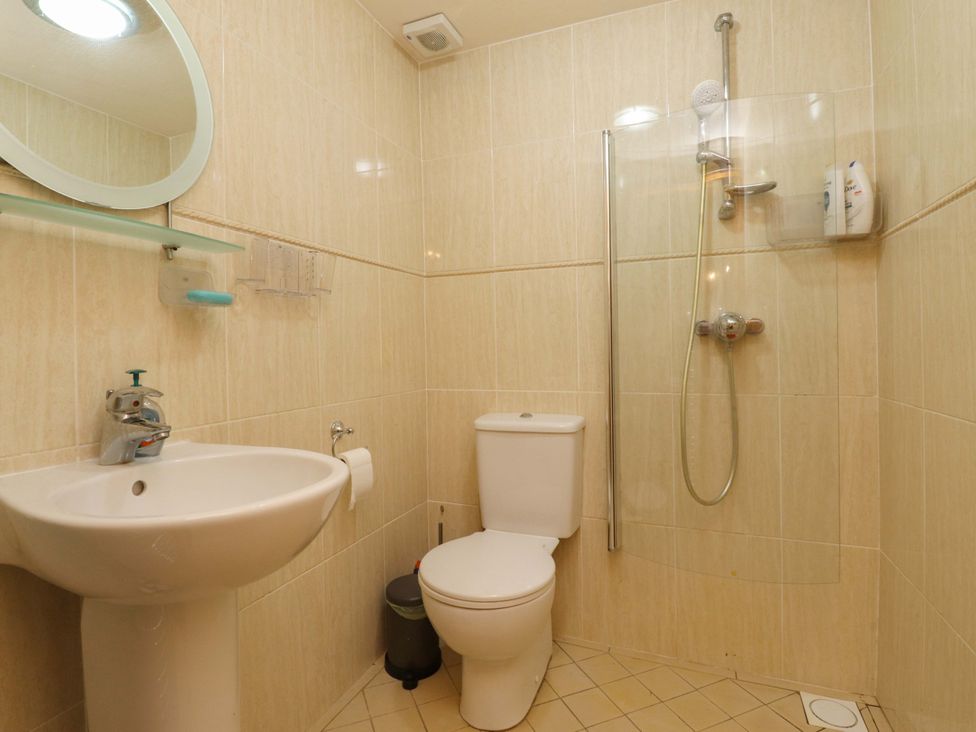 A bathroom with a shower and a toilet at Sheephouse Farm in Bacup