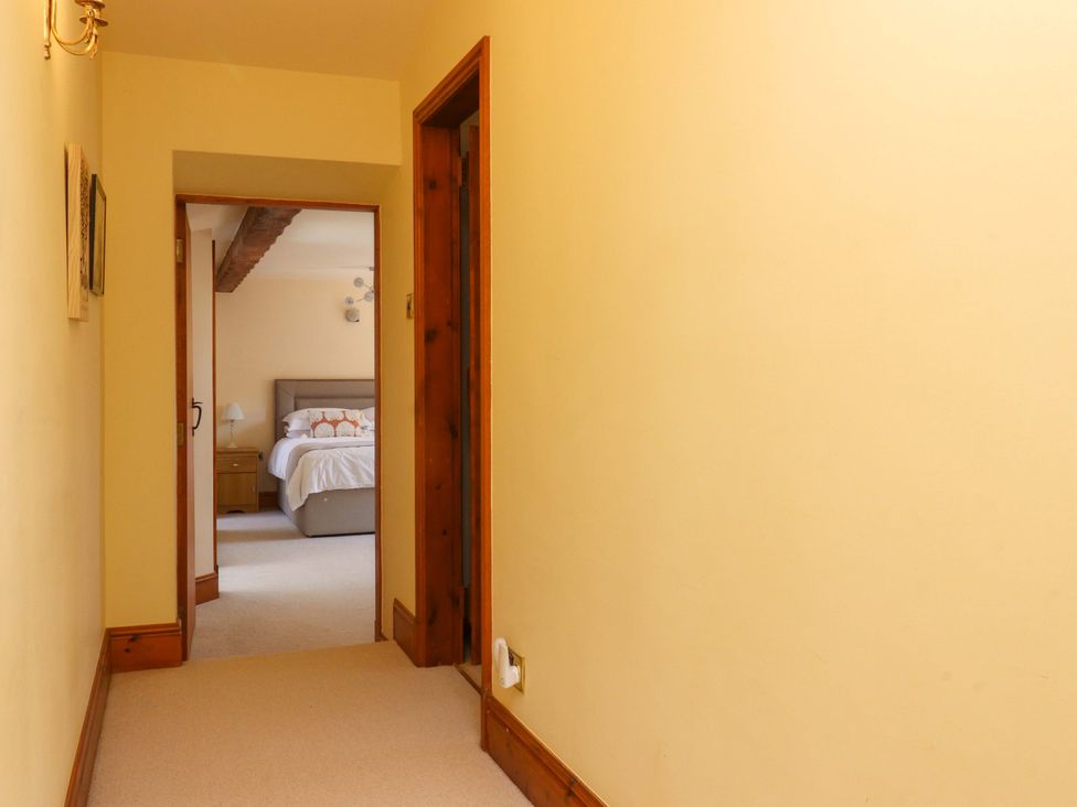 A hallway leading to a bedroom at Sheephouse Farm in Bacup