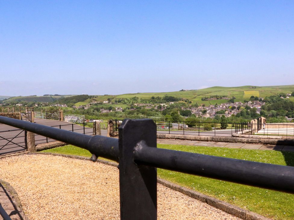 A view of hills and buildings from a terrace at Sheephouse Farm in Bacup