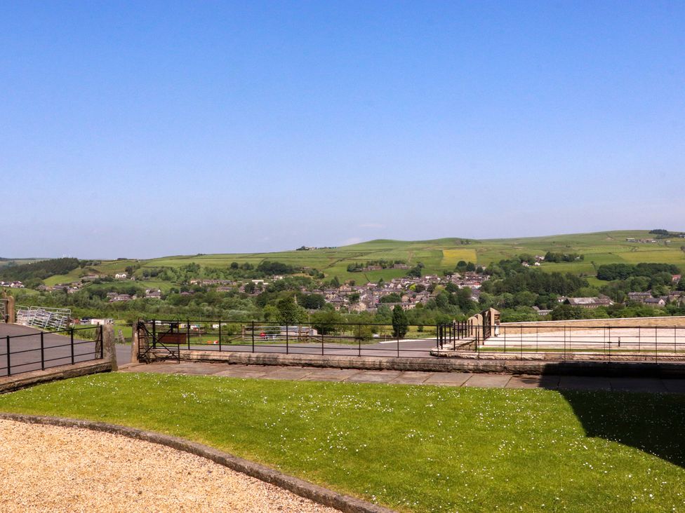 An outdoor view of hills and houses at Sheephouse Farm in Bacup