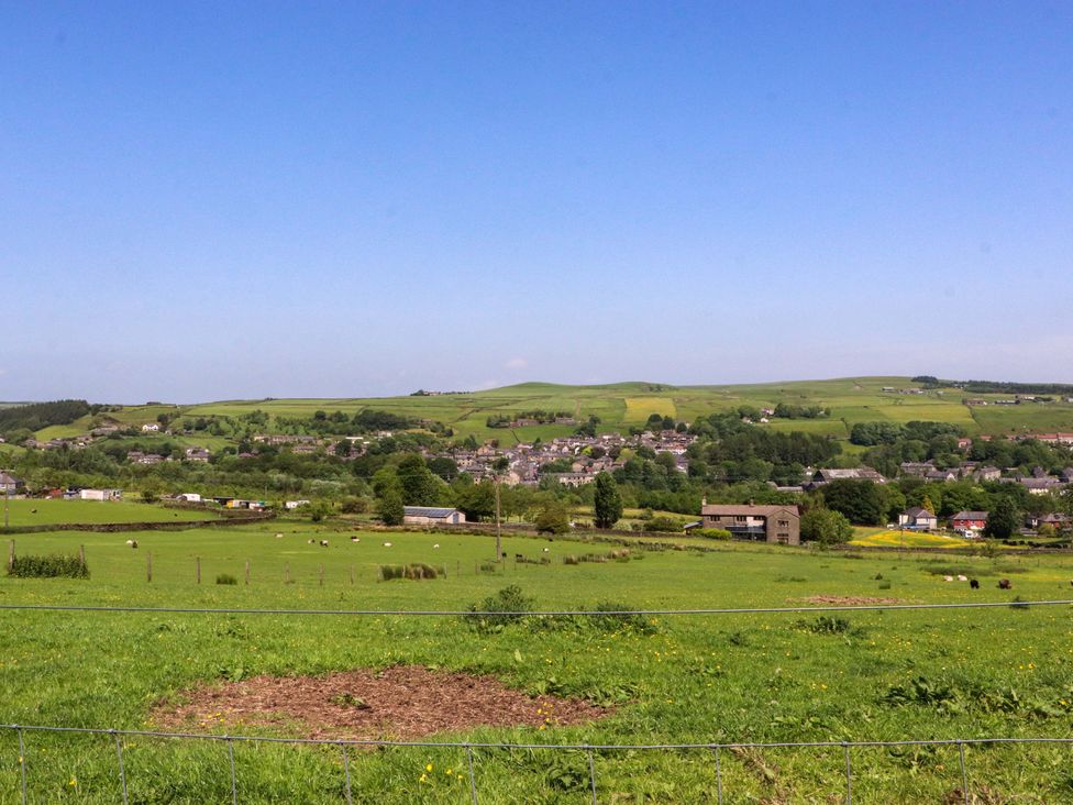 A rural landscape with fields and houses at Sheephouse Farm in Bacup