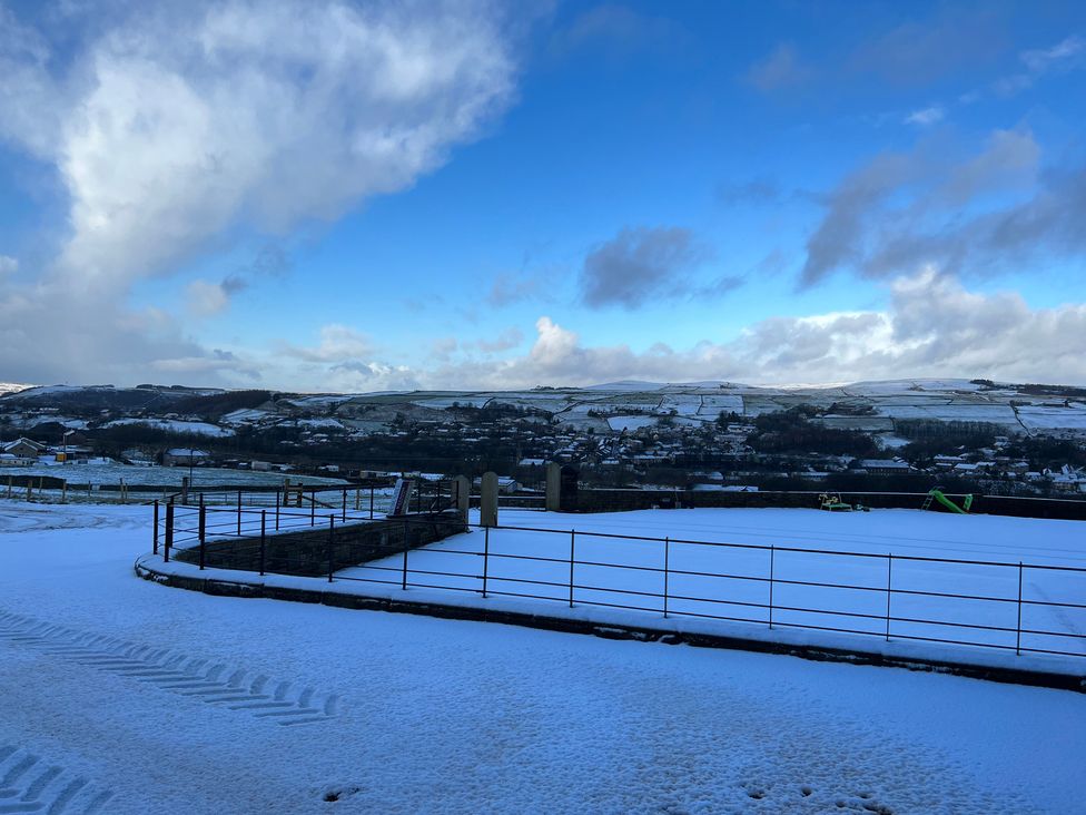 A landscape with snow and hills at Sheephouse Farm in Bacup