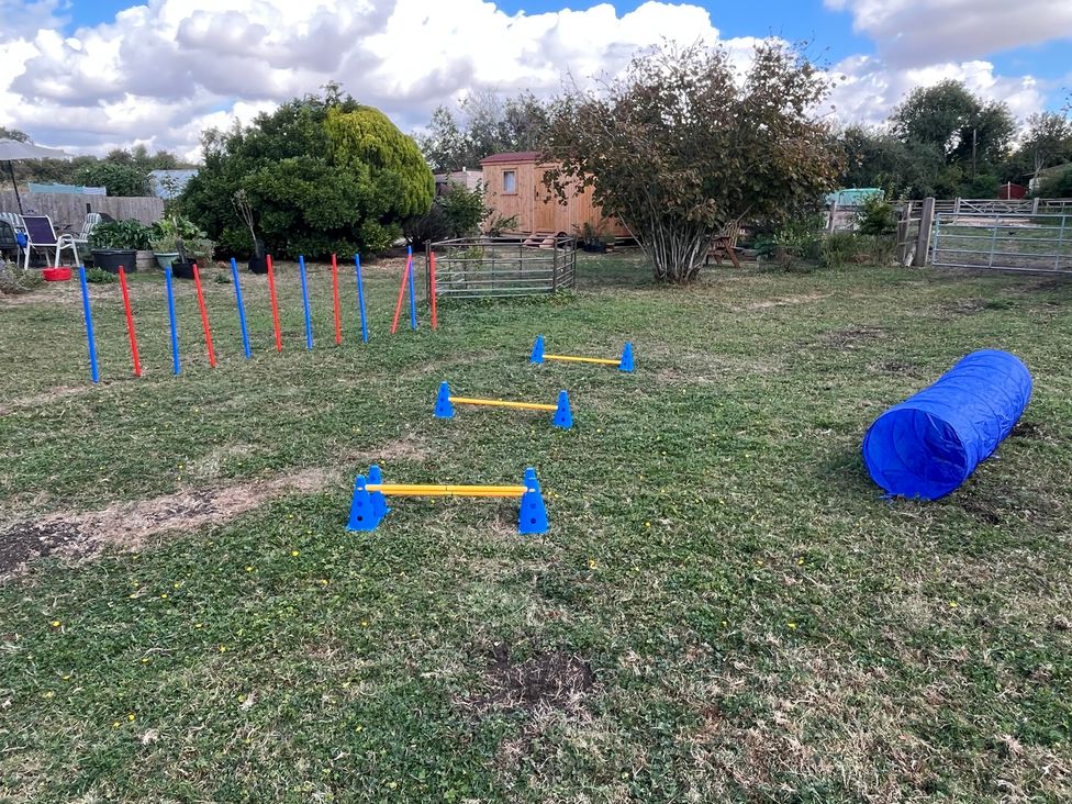 An outdoor agility training area with equipment at Laurel in Littleport