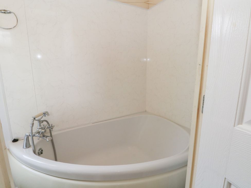 A bathtub in a bathroom at Hawks View Caravan Macclesfield