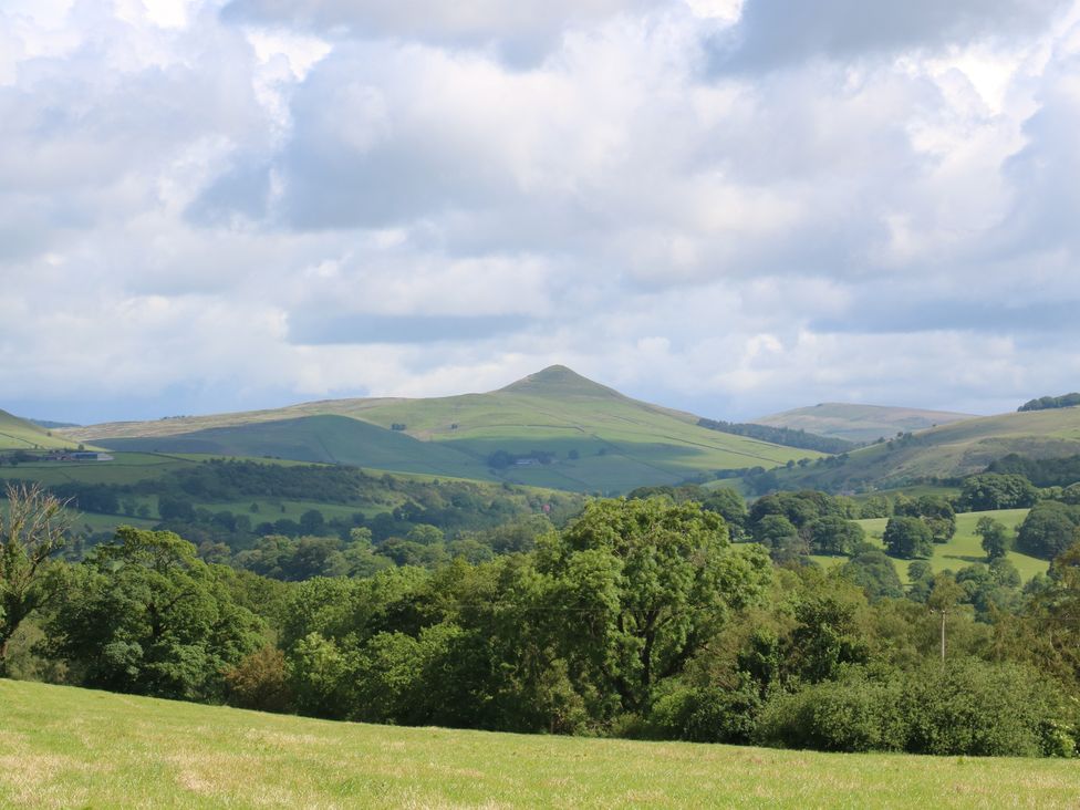A view of hills and trees in a natural landscape at Hawks View Caravan, Macclesfield