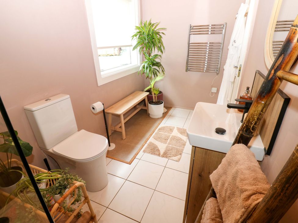 A bathroom with a sink and toilet at Bull Rush Cabin Carwinley near Longtown