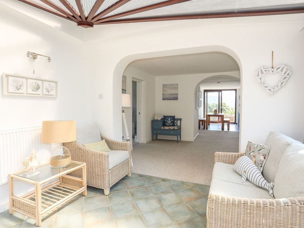 A living room with sofas and a coffee table at Bryn Llifon in Pentraeth