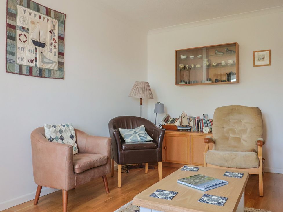 A living room with chairs and a table at Seaview in Lyme Regis
