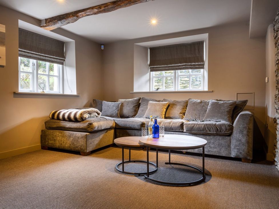 A snug with a sofa and coffee table at Prospect House in Windermere