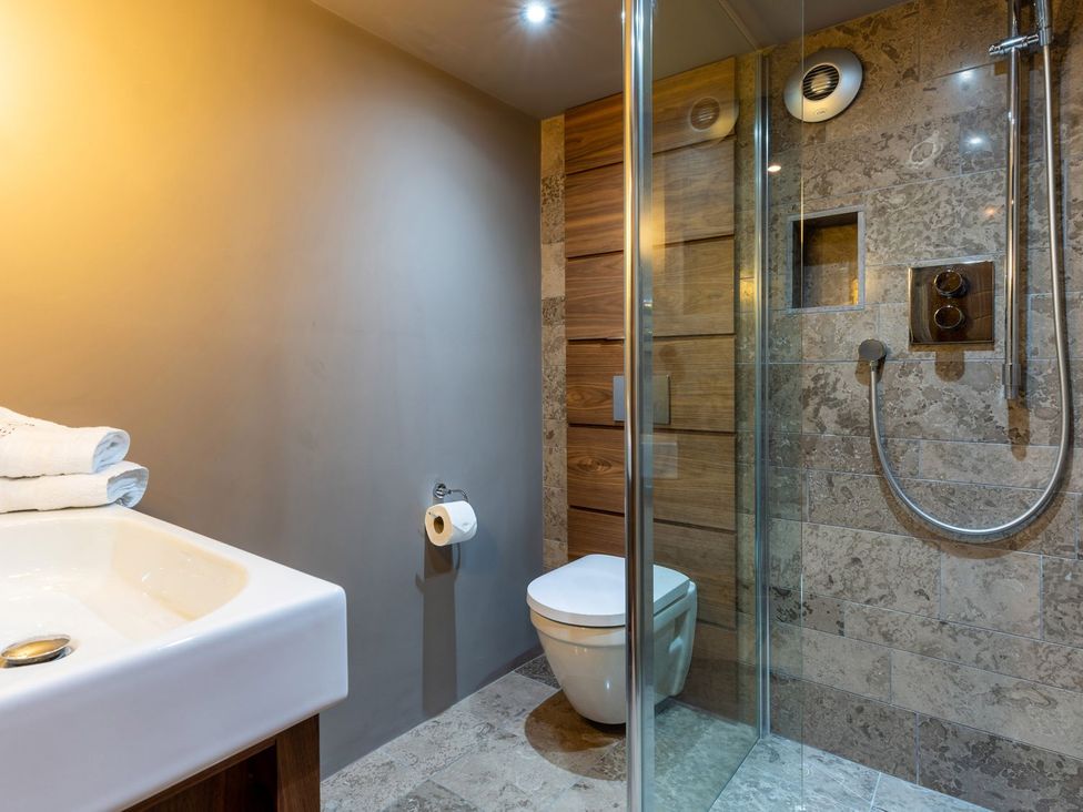 A bathroom featuring a sink, toilet, and shower at Prospect House in Windermere