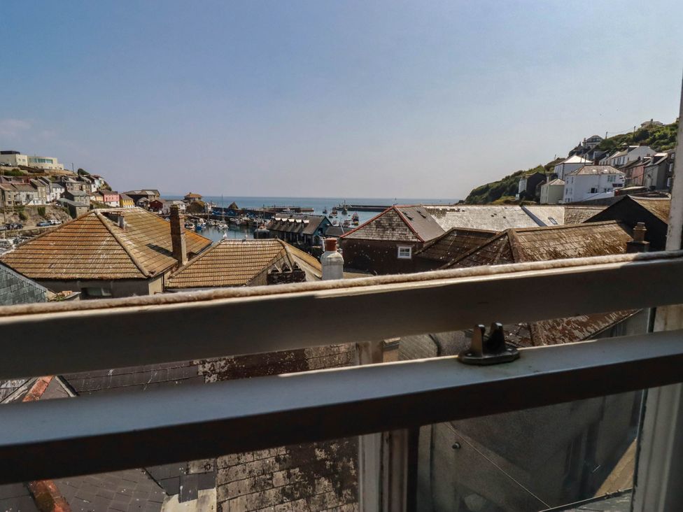 An outdoor view of boats in a harbor at Stones Throw in Mevagissey