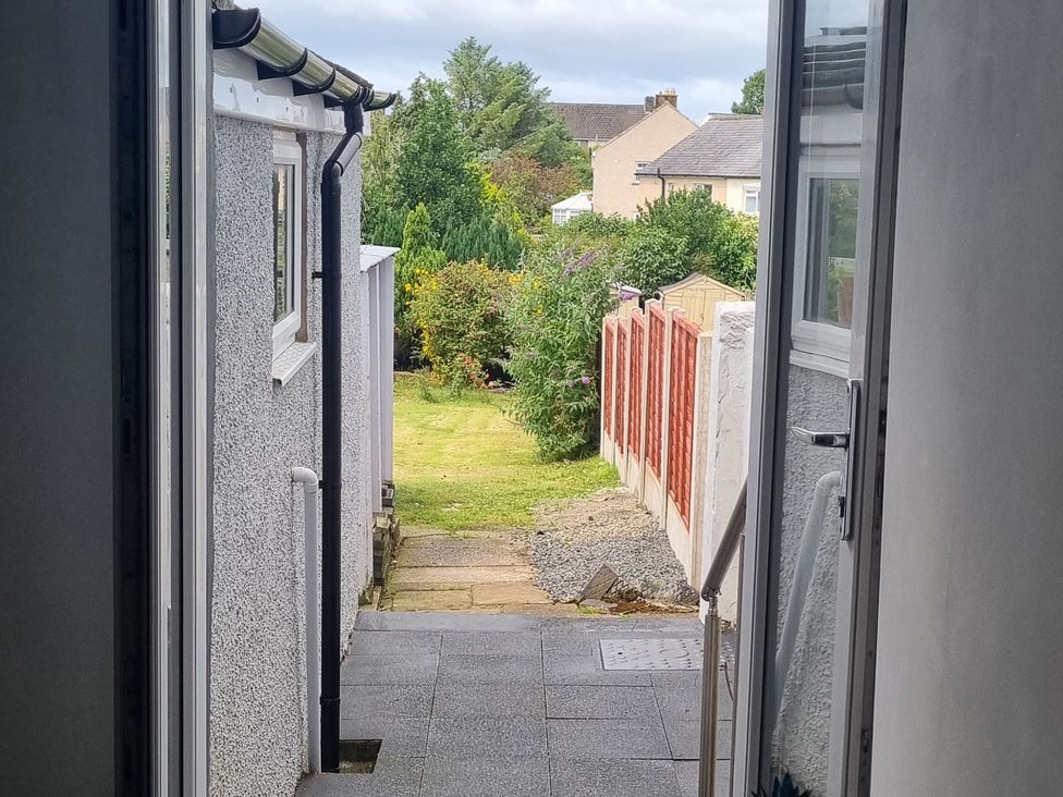 A garden view with a pathway and fence at 3 Greystone Terrace Cleator Moor