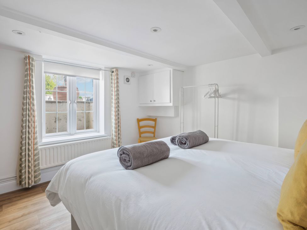 A bedroom with a bed and towels on it at TBC 