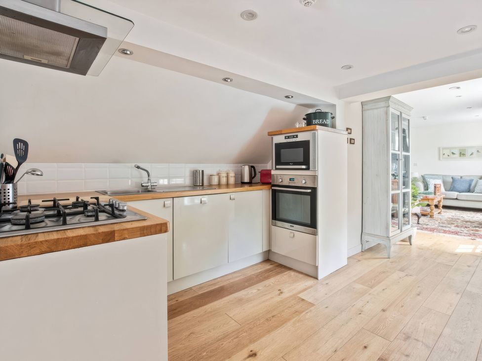 A kitchen with a gas stove and oven at TBC 