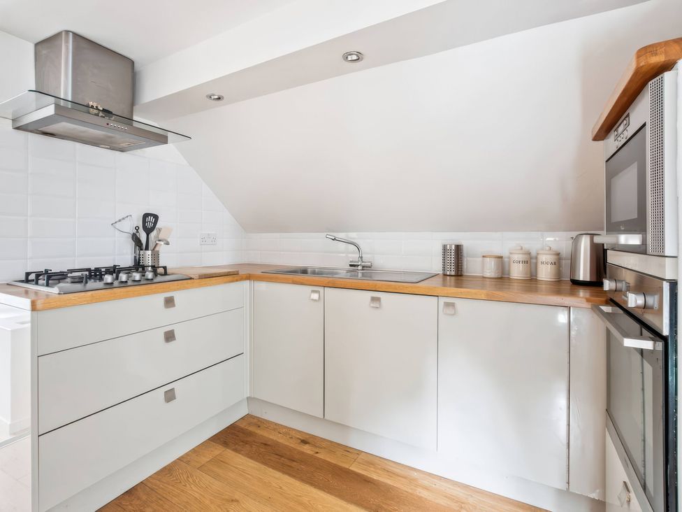 A kitchen with sink and gas cooker at TBC 