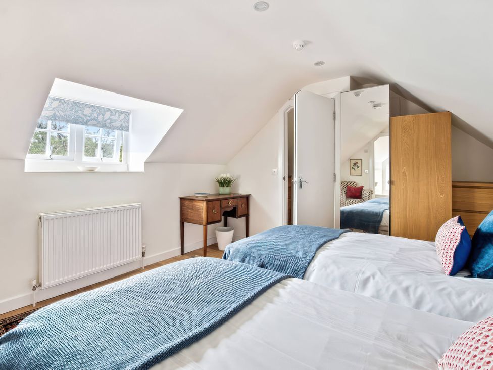 A bedroom with two beds and a window at TBC in 