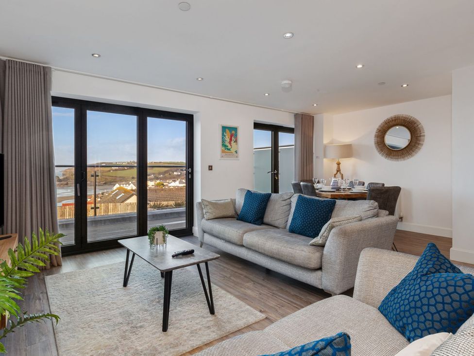 A living room with a sofa and coffee table at One Sand Banks Haverfordwest