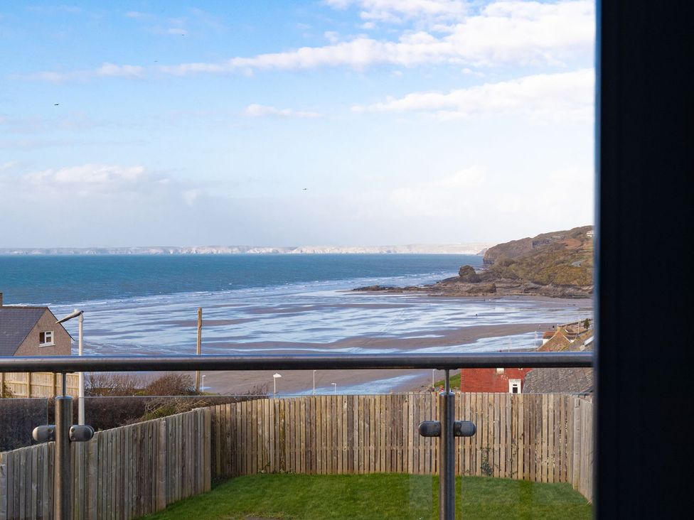 A view of the beach and ocean from a property at One Sand Banks Haverfordwest