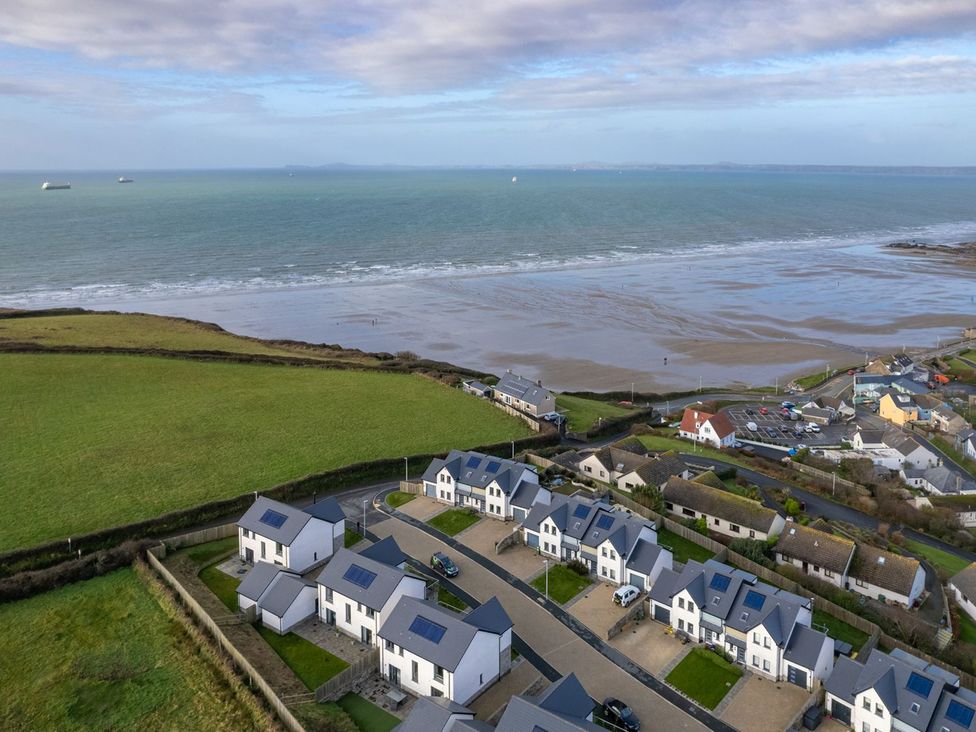 An aerial view of houses by the beach at One Sand Banks Haverfordwest