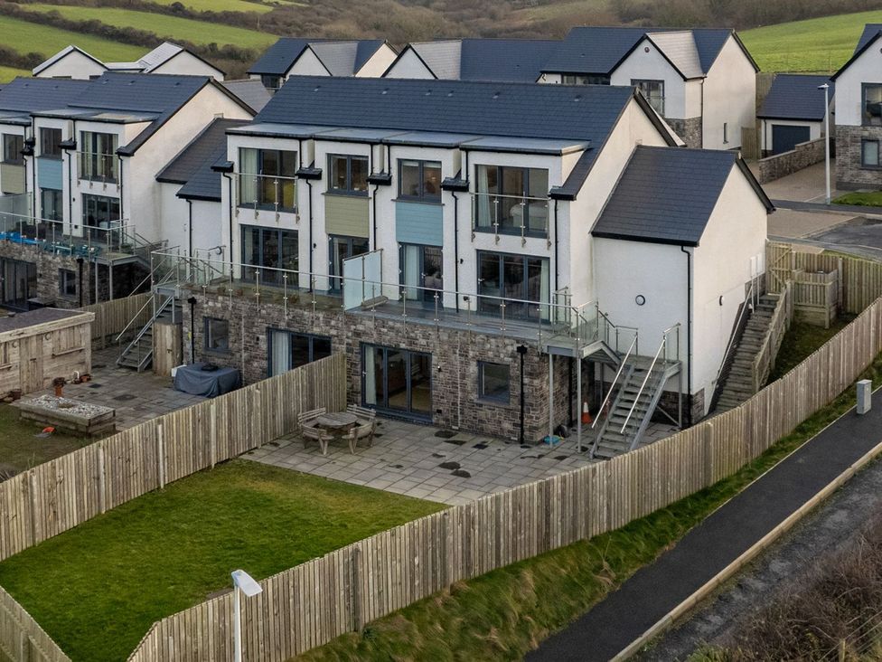 A view of houses with balconies and patios at One Sand Banks in Haverfordwest