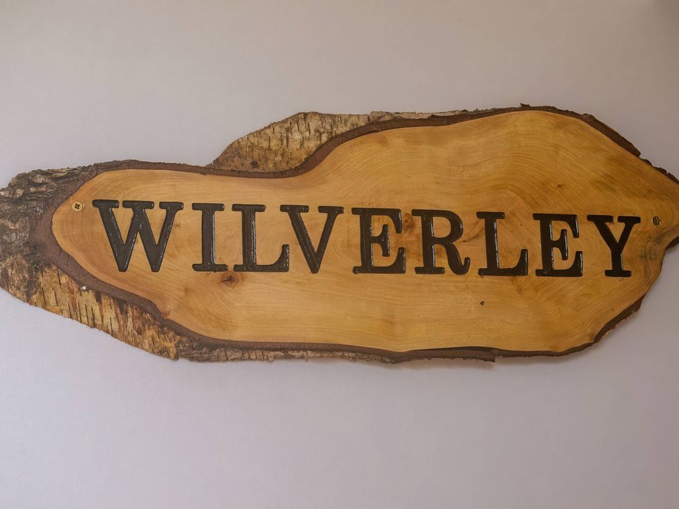 A wooden sign with the text WILVERLEY