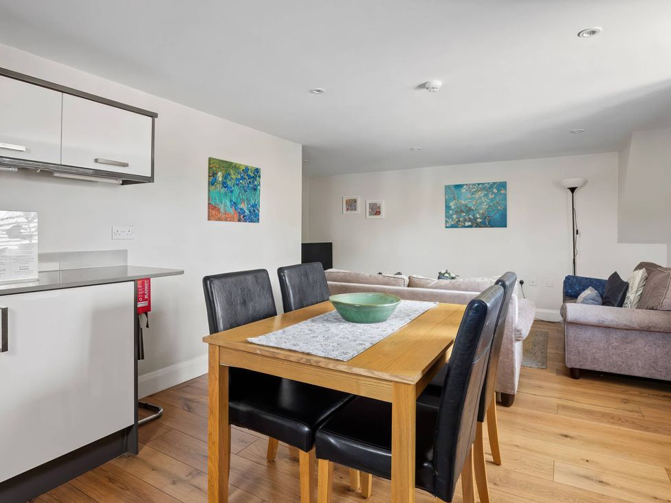 A dining room with a table and chairs at TBC in 