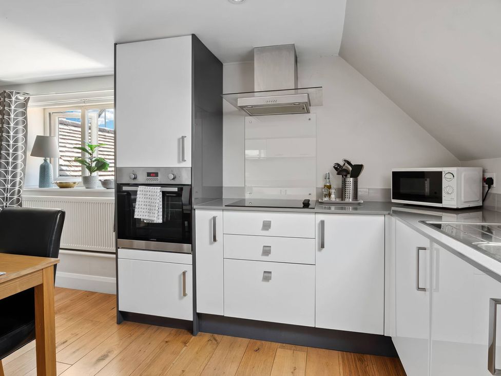 A kitchen with appliances and utensils at TBC