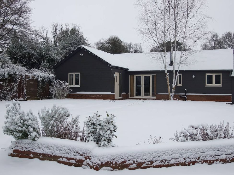 A house covered in snow with a garden at TBC 