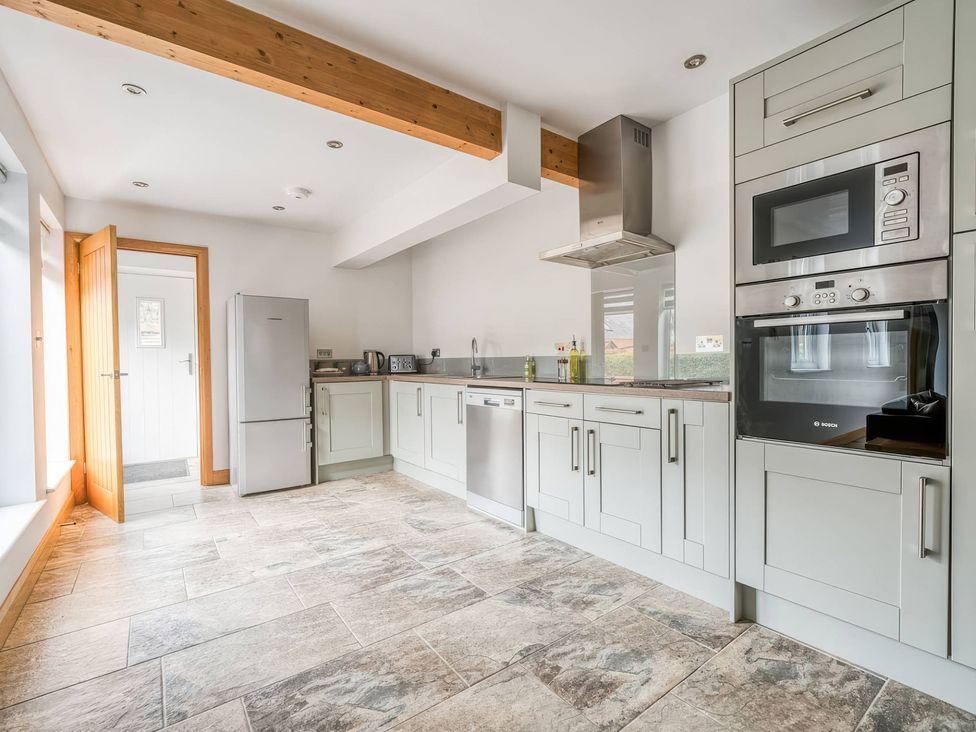 A kitchen with modern appliances at TBC 