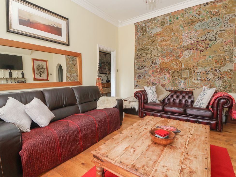 A living room with sofas and a coffee table at Tapestry House in Bridlington