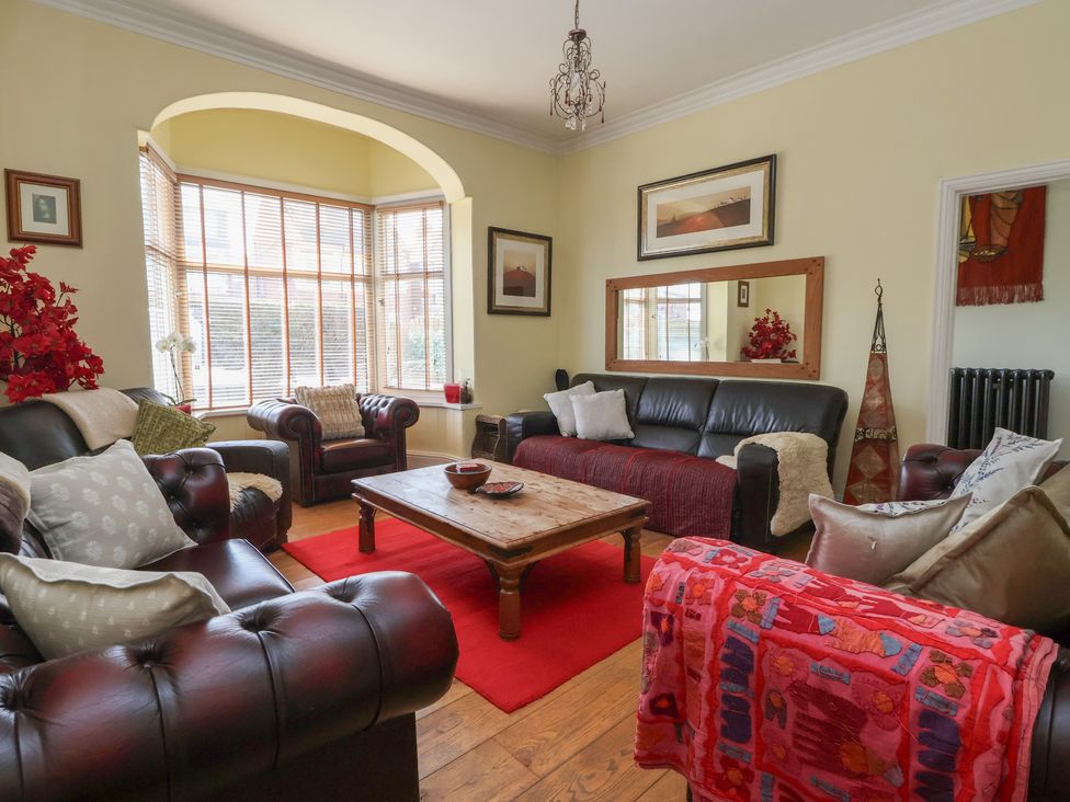 A living room with sofas and a coffee table at Tapestry House in Bridlington