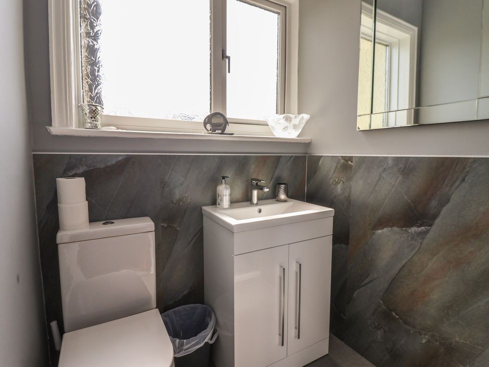 A bathroom with a toilet and sink at Tapestry House in Bridlington